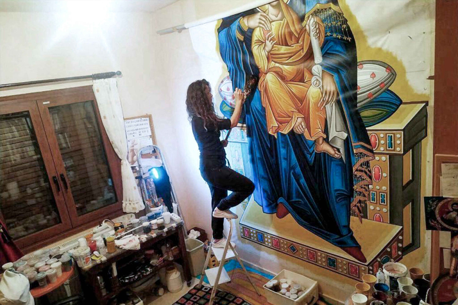 Alexandra Kaouki painting the Platytera of the Heavens, a Byzantine wall icon of the Virgin Mary