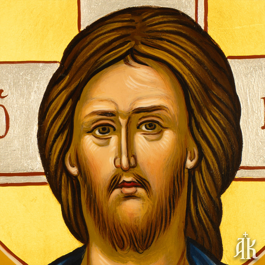 Close-up detail of Jesus Christ Pantocrator face in Byzantine icon, showing solemn expression and spiritual depth
