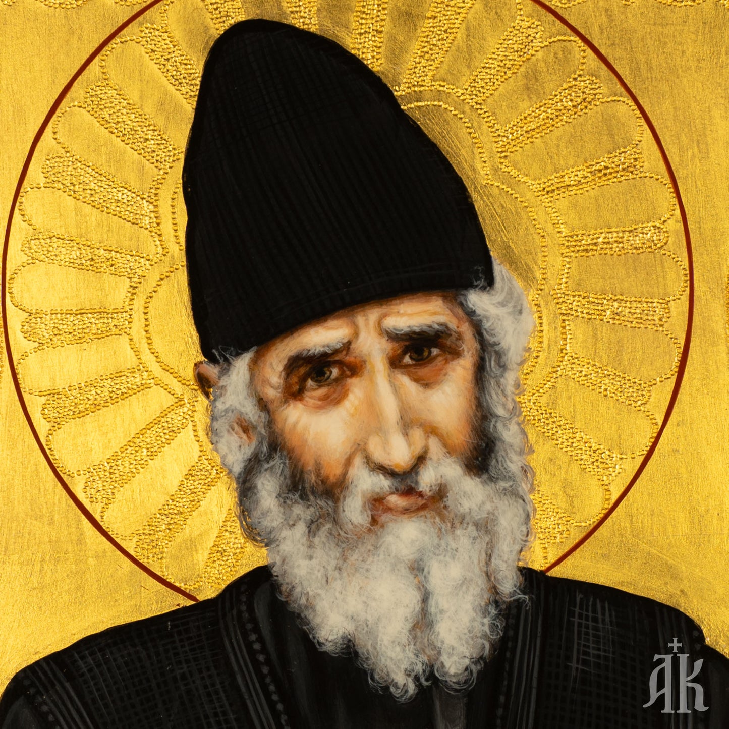 Close-up detail of Saint Paisios face in Byzantine icon, showing gentle expression and spiritual depth